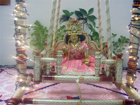 Statue of Krishna on a swing